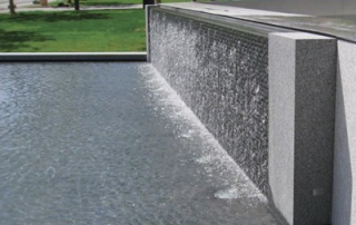 cascading-water-wall-fountain Water walls create a unique display that allows for flowing water in a limited space